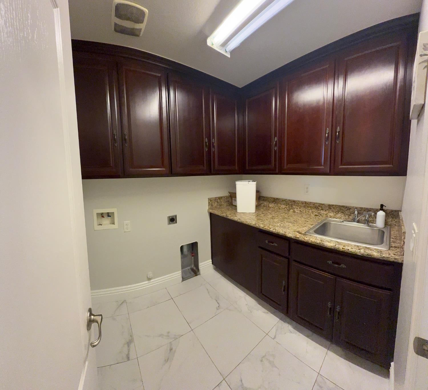 11816 Spring Walk Way Rancho Cordova, CA 95742 - Photo 18 of 36 a kitchen with granite countertop stainless steel appliances wooden cabinets and a sink