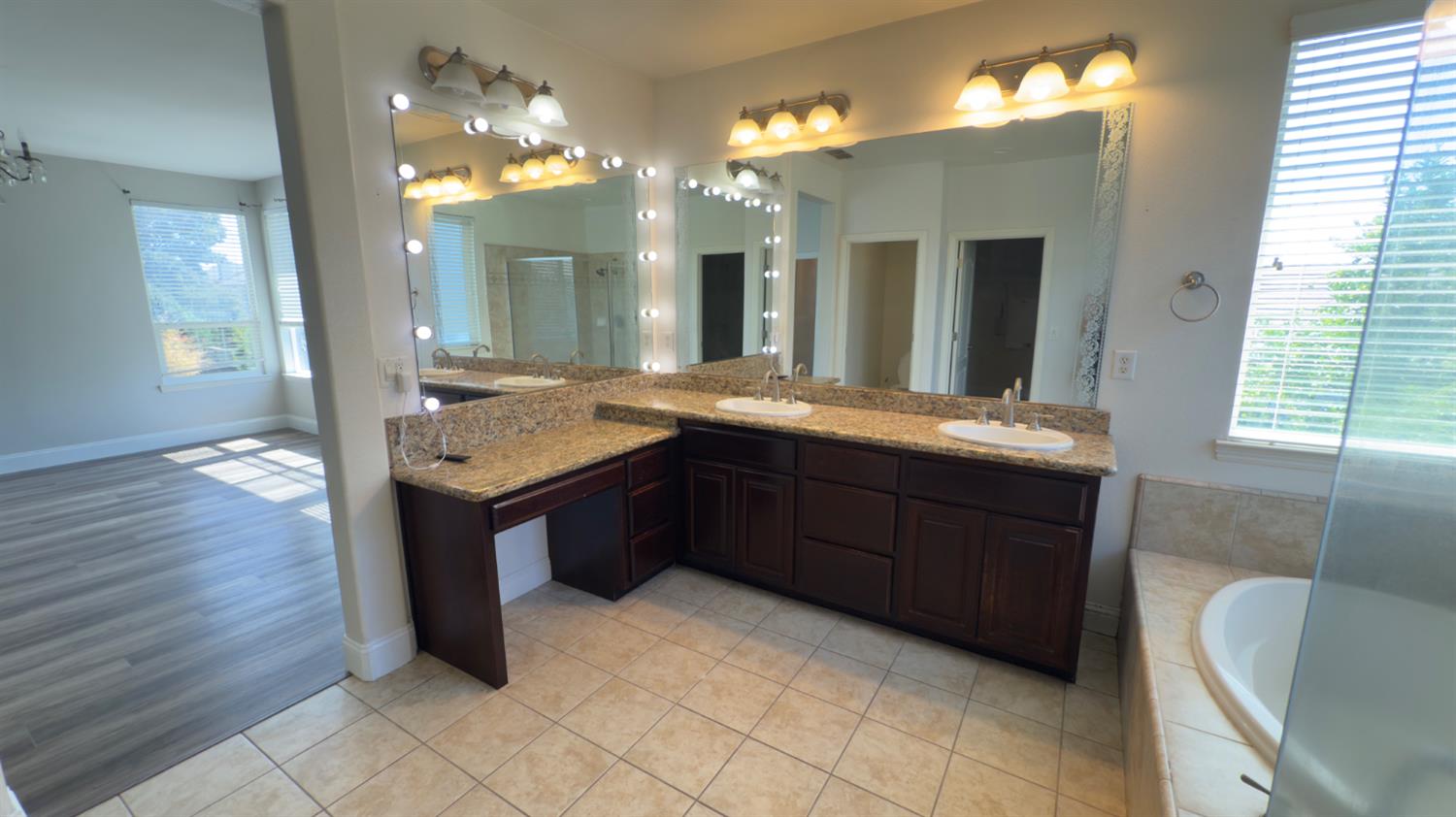 11816 Spring Walk Way Rancho Cordova, CA 95742 - Photo 28 of 36 a bathroom with a granite countertop sink and a mirror