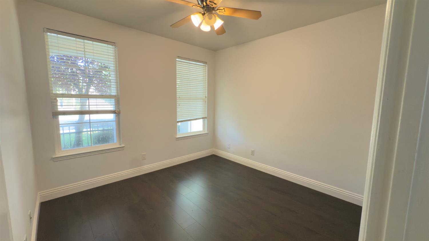 11816 Spring Walk Way Rancho Cordova, CA 95742 - Photo 30 of 36 a view of an empty room with wooden floor and a window
