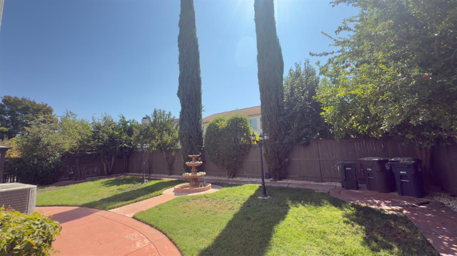 11816 Spring Walk Way Rancho Cordova, CA 95742 - Photo 35 of 36 a view of a backyard with plants and a garden