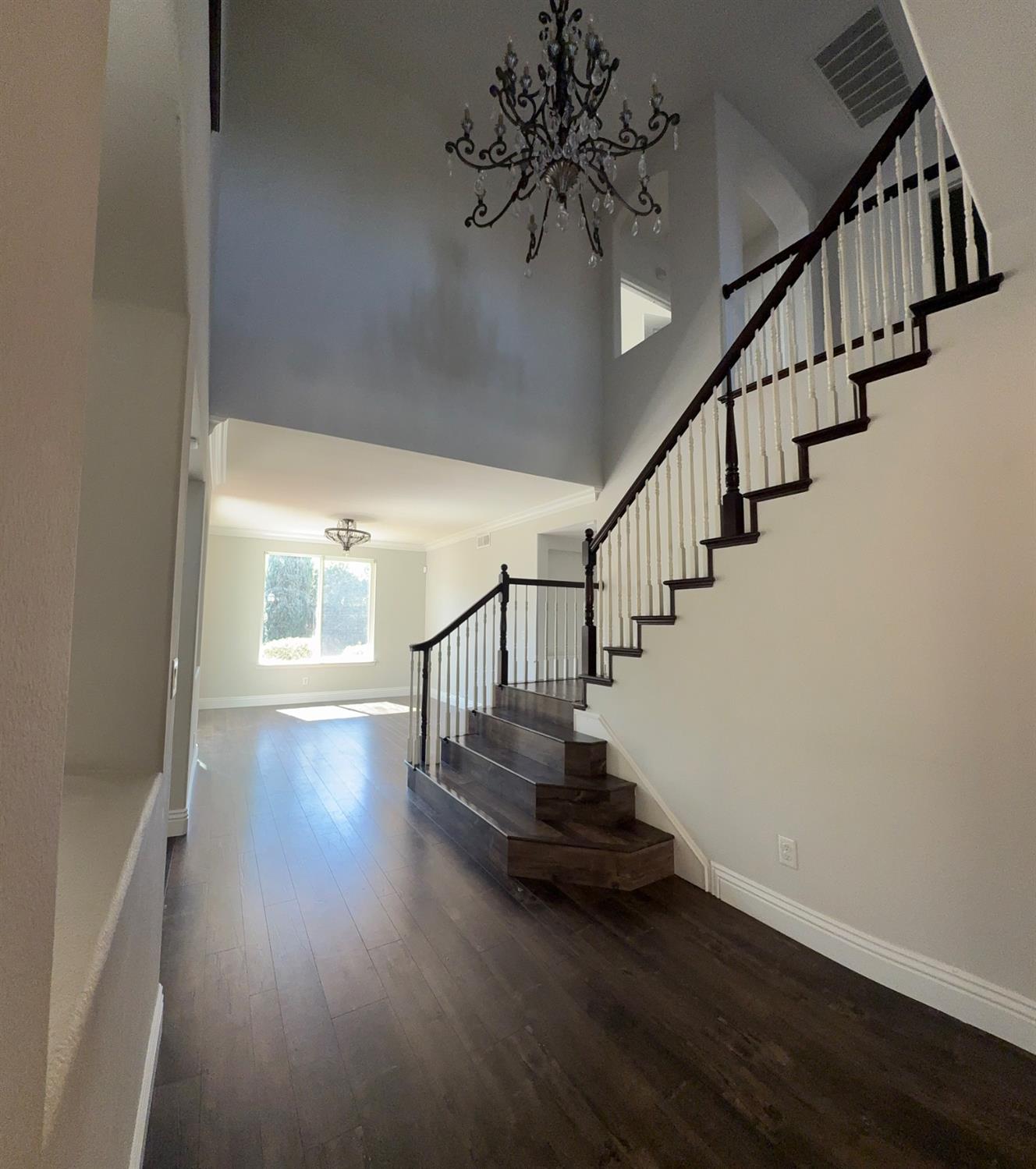 11816 Spring Walk Way Rancho Cordova, CA 95742 - Photo 4 of 36 a view of entryway and hall with wooden floor