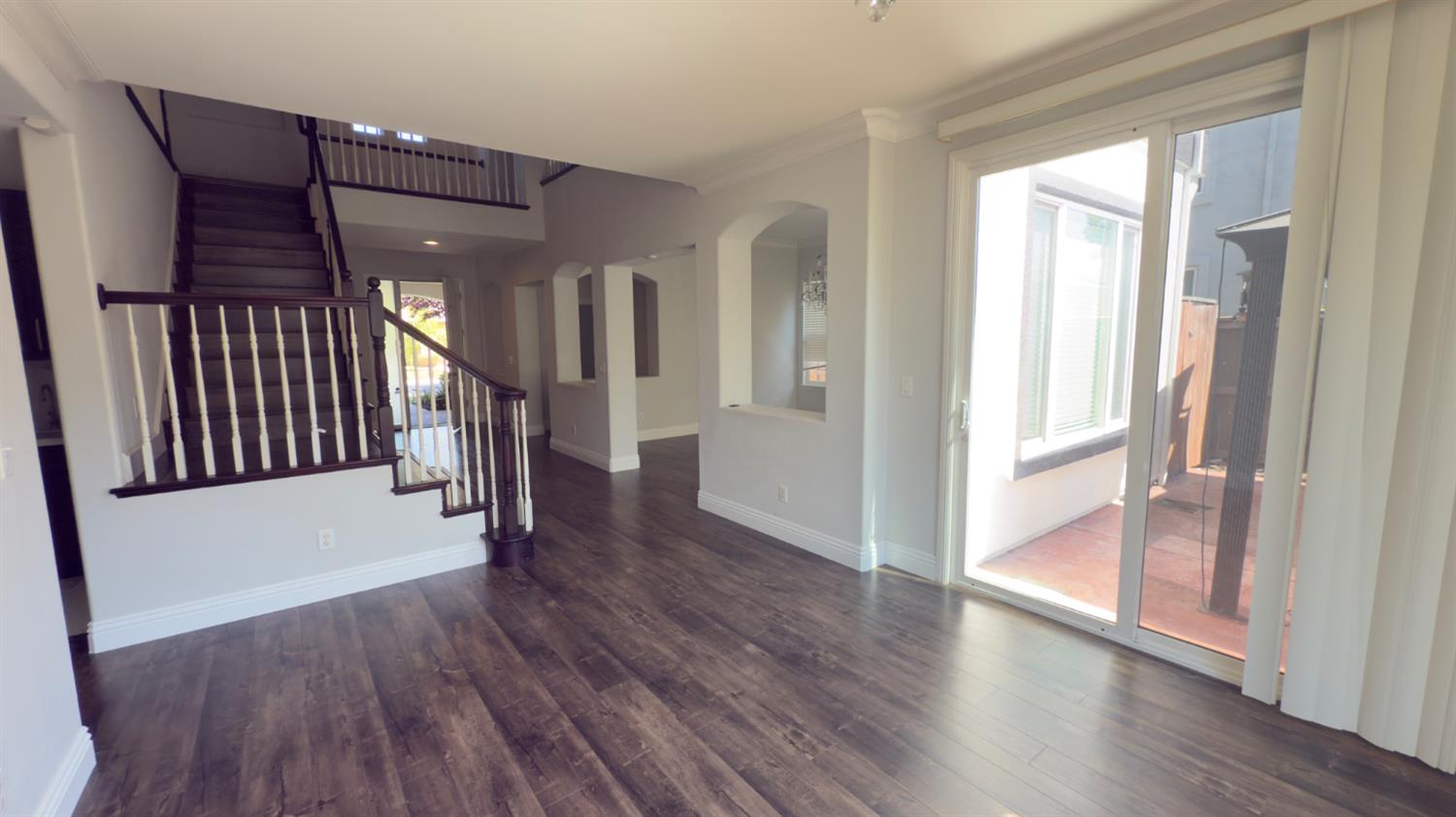 11816 Spring Walk Way Rancho Cordova, CA 95742 - Photo 7 of 36 a view of a hallway with wooden floor and stairs