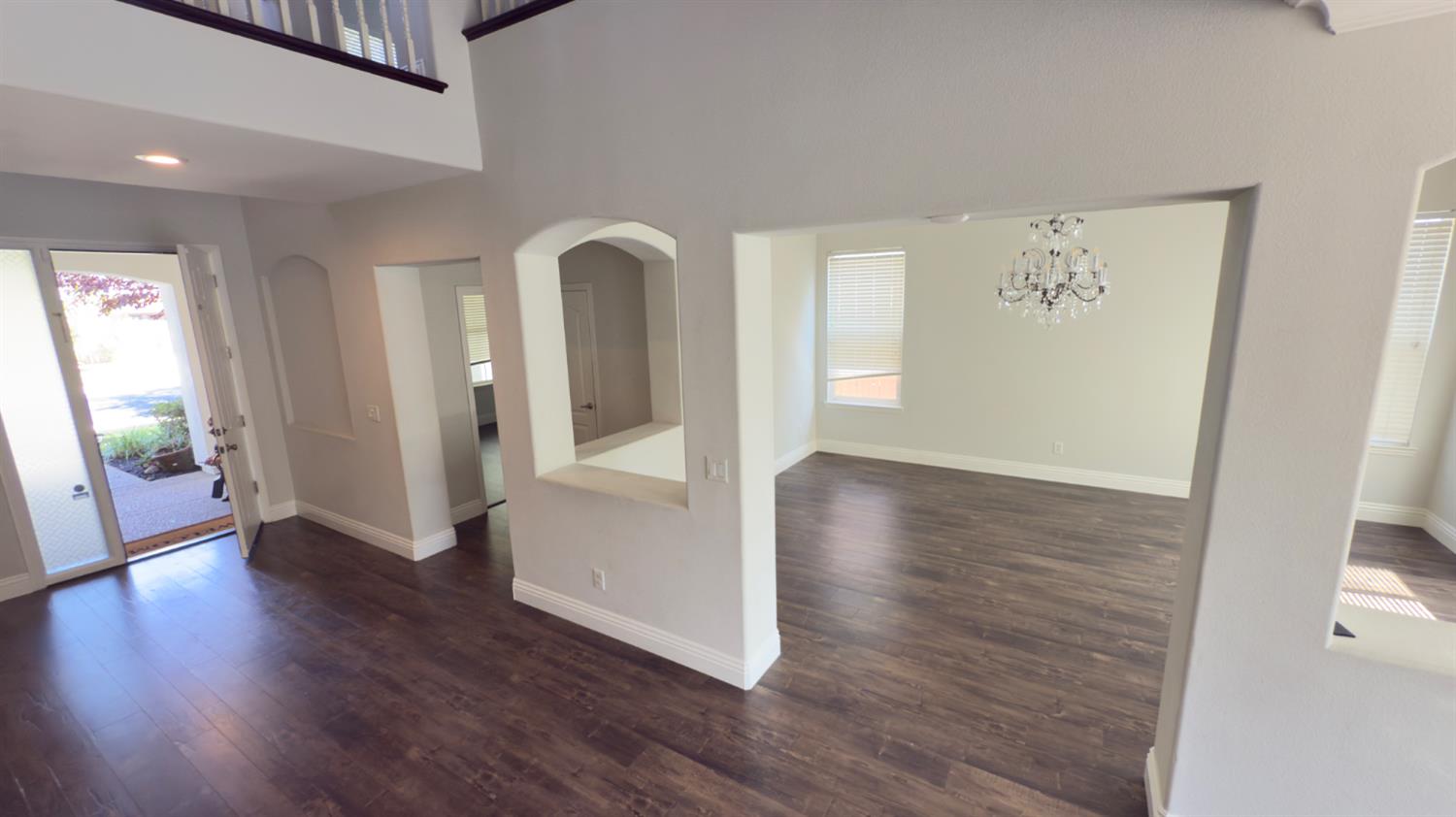 11816 Spring Walk Way Rancho Cordova, CA 95742 - Photo 8 of 36 wooden floor in an empty room with a window