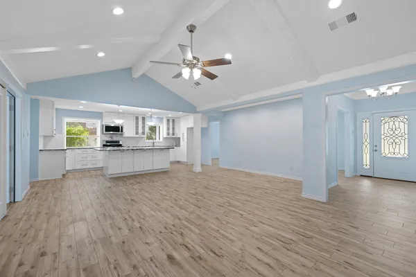 a view of an empty room with a window