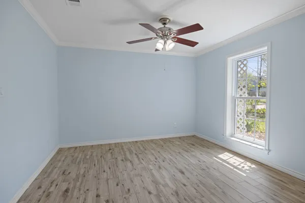 wooden floor in an empty room with a workspace