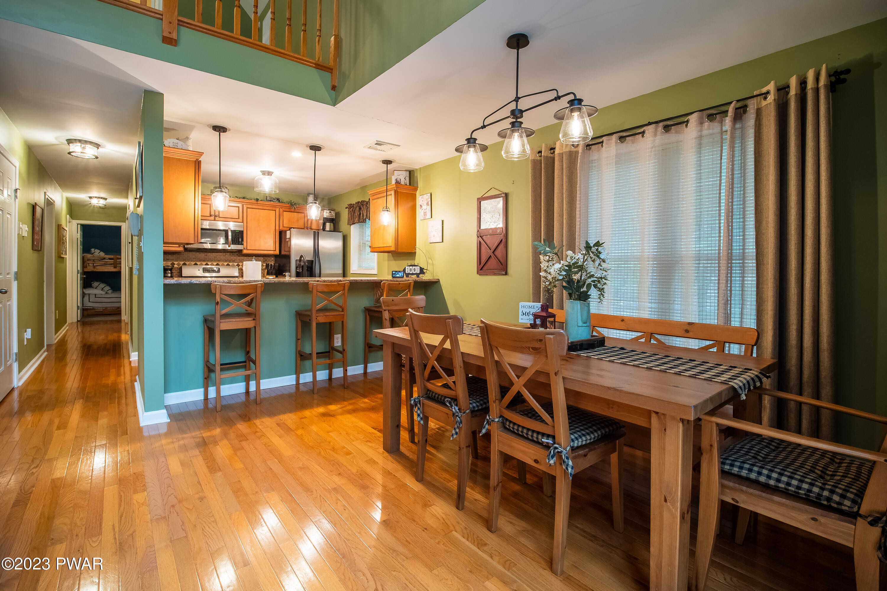 493 Northgate Road Lake Ariel, PA 18436 - Photo 11 of 37 a view of a dining room with furniture window and wooden floor