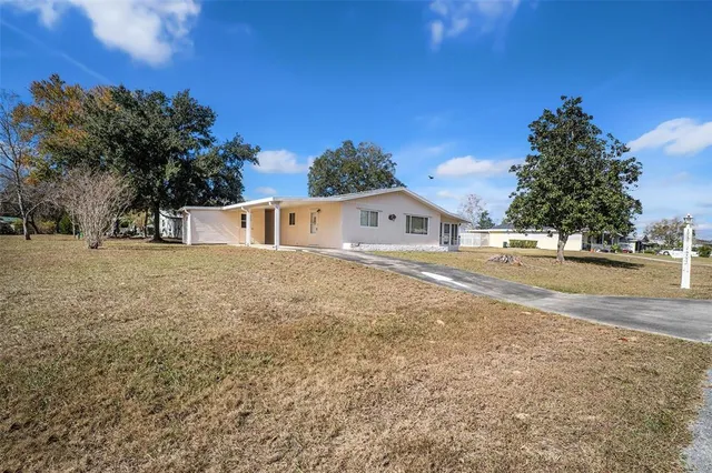 a view of house with outdoor space and street view