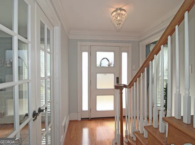 a view of entryway with wooden floor