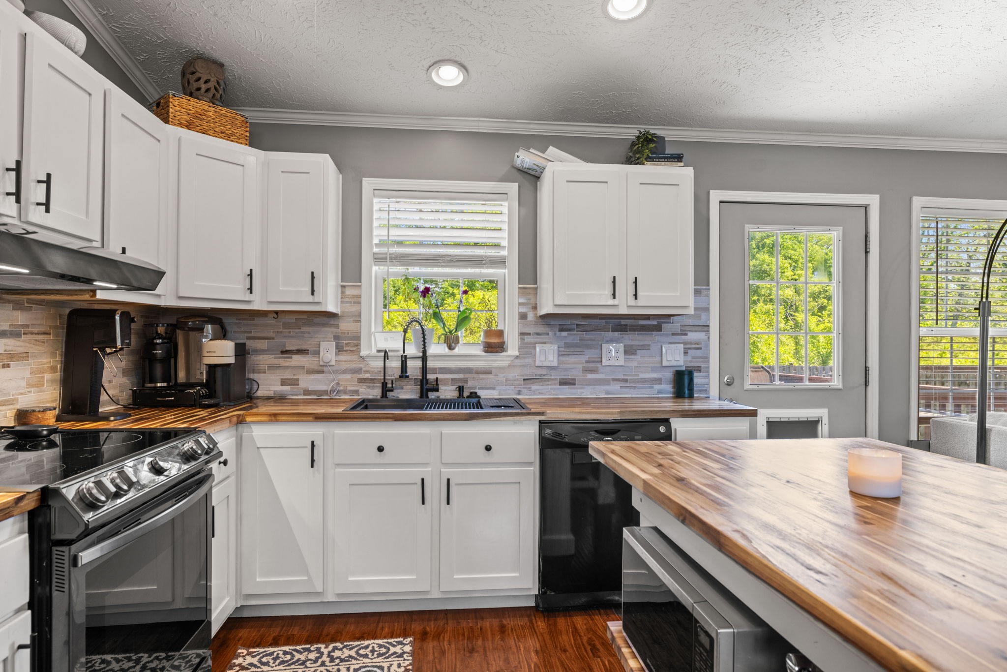 1154 Wrights Mill Road Spring Hill, TN 37174 - Photo 11 of 38 a kitchen with granite countertop a sink stove and cabinets