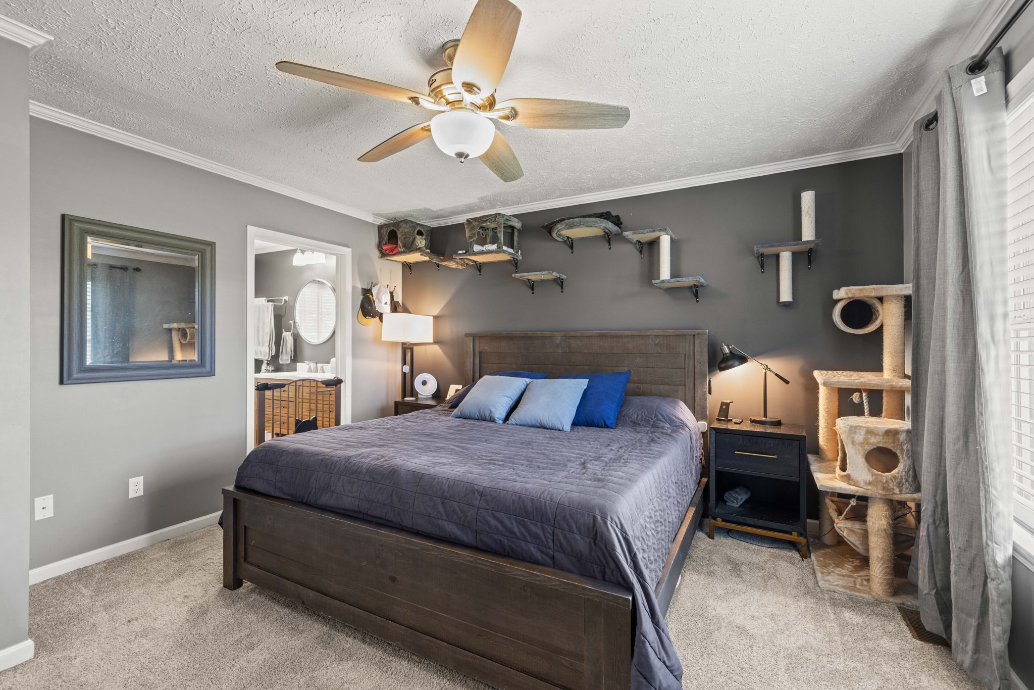 1154 Wrights Mill Road Spring Hill, TN 37174 - Photo 18 of 38 a bedroom with a bed and a chandelier