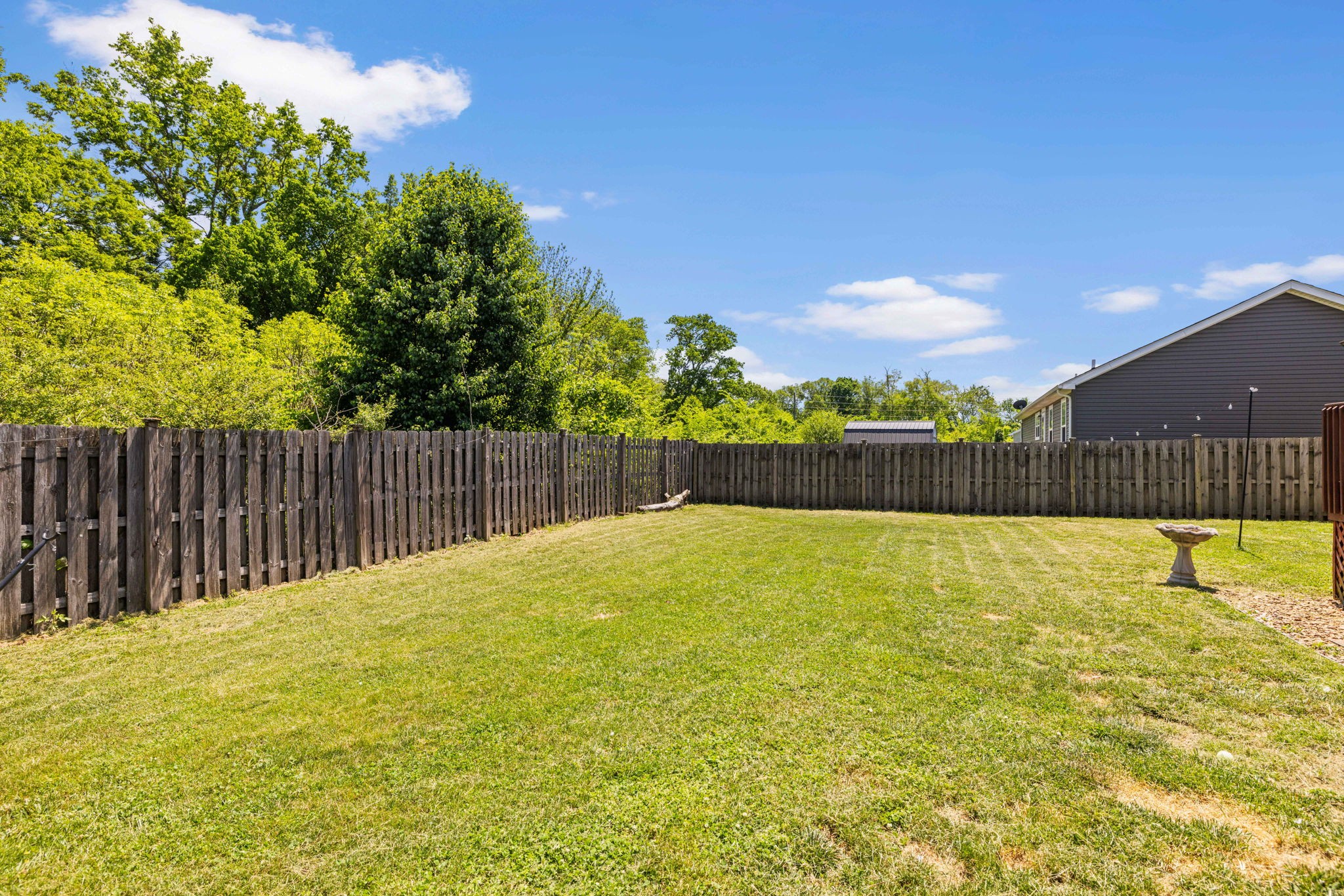 1154 Wrights Mill Road Spring Hill, TN 37174 - Photo 35 of 38 a swimming pool with wooden fence