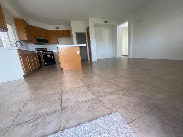 a view of kitchen with furniture and cabinets