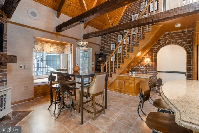a view of a livingroom with furniture and a flat screen tv