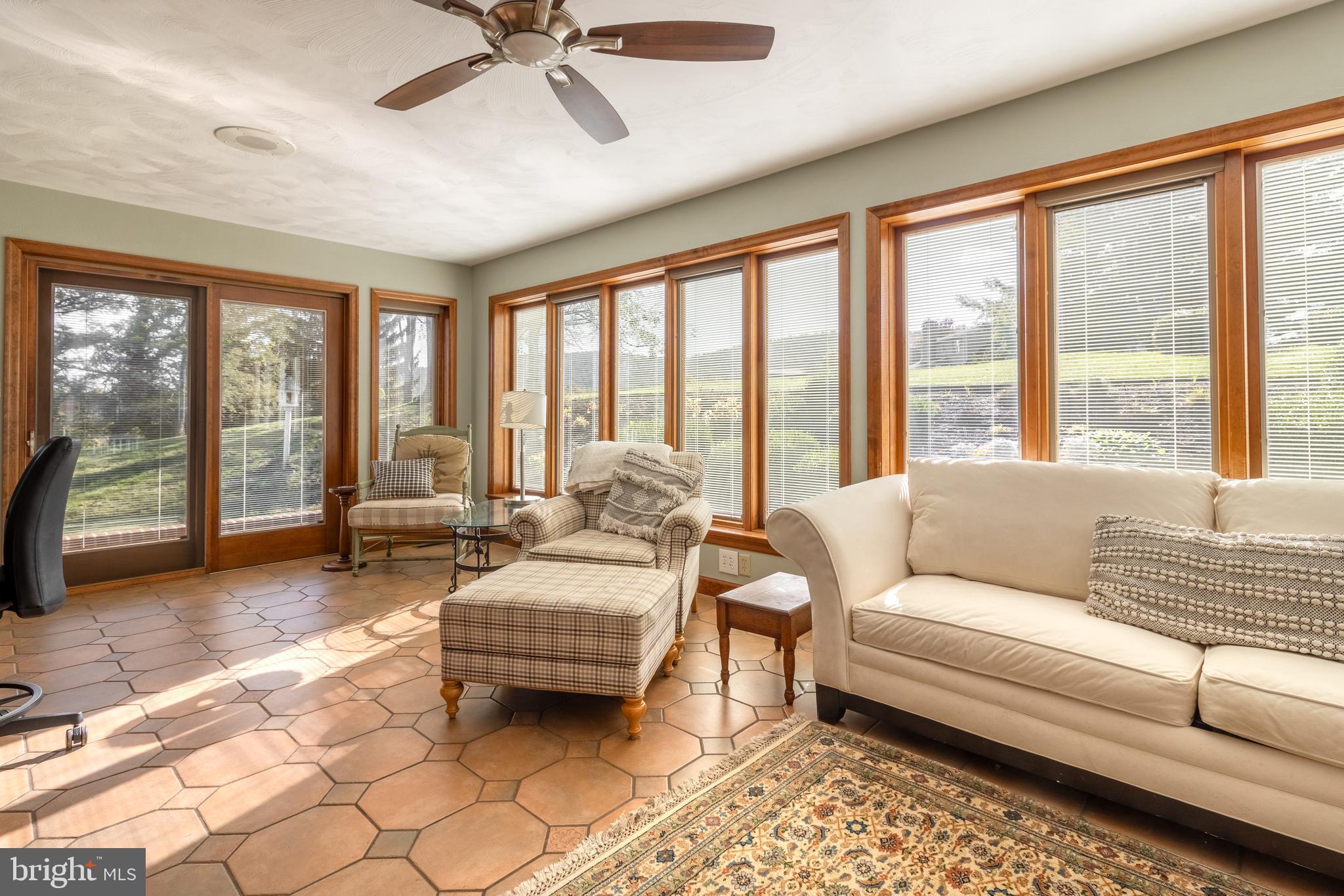 261 Old Fort Road Spring Mills, PA 16875 - Photo 17 of 54 a living room with furniture and large windows