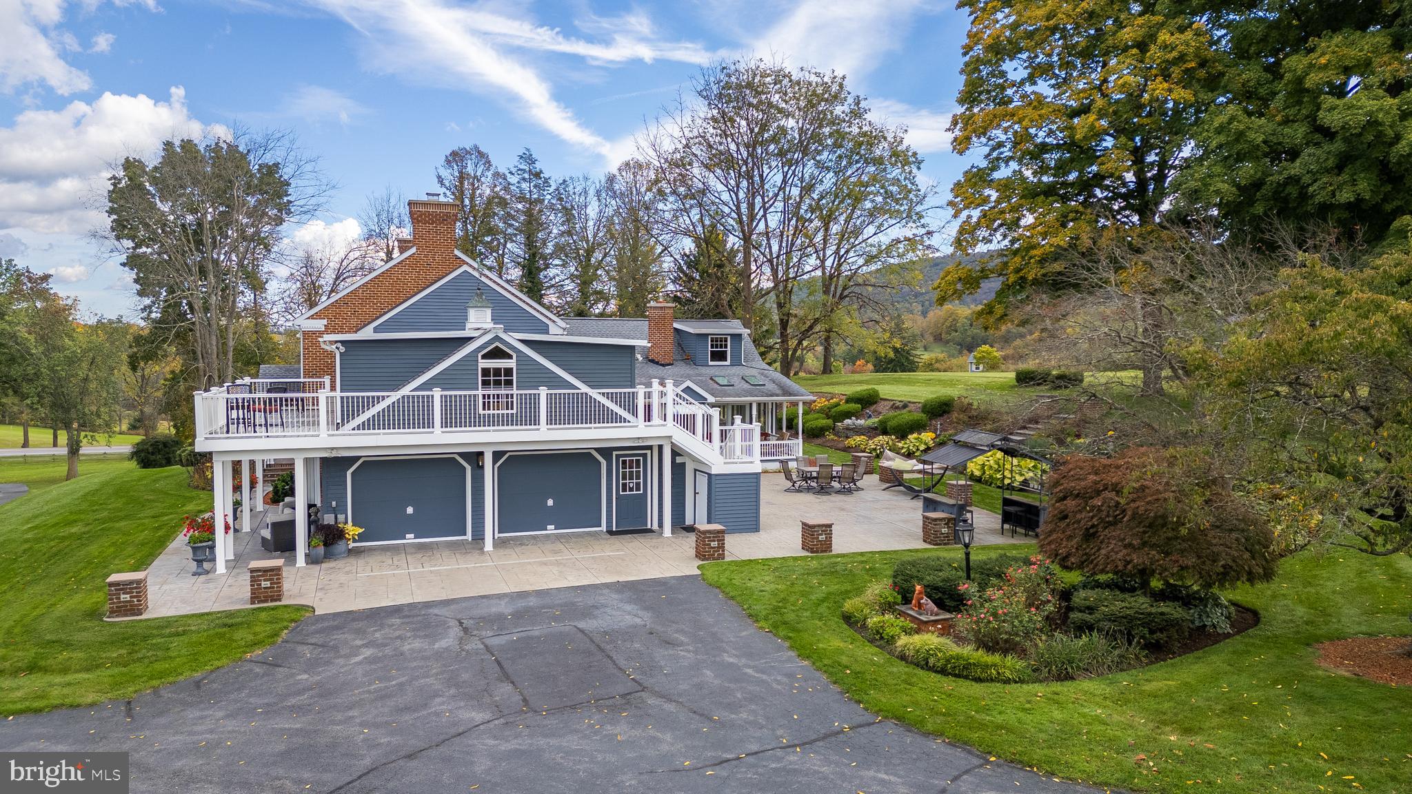 261 Old Fort Road Spring Mills, PA 16875 - Photo 41 of 54 a front view of a house with a yard and potted plants