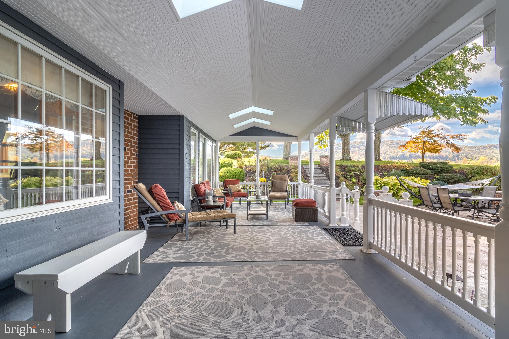 261 Old Fort Road Spring Mills, PA 16875 - Photo 45 of 54 a living room with furniture and floor to ceiling windows