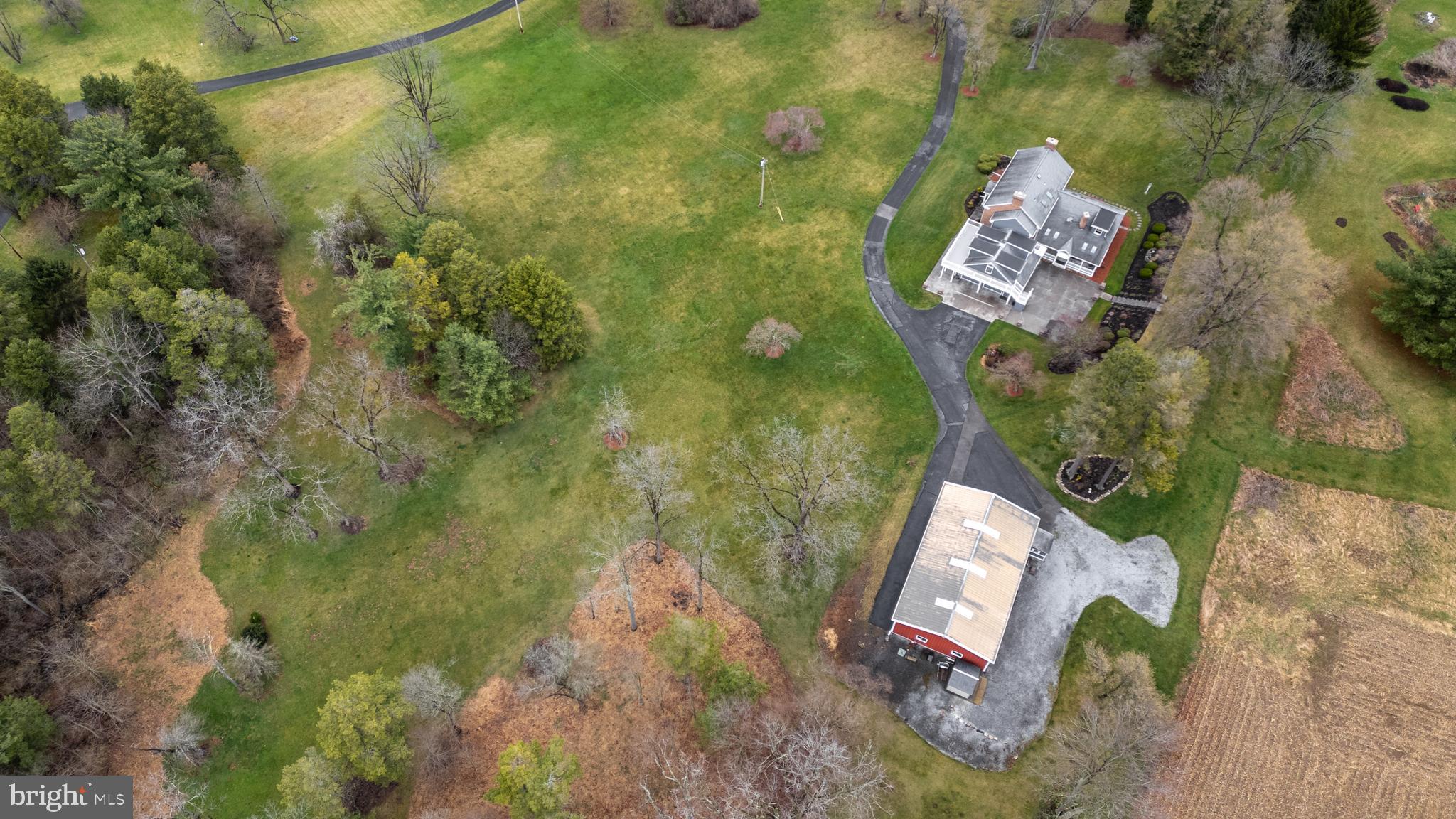 261 Old Fort Road Spring Mills, PA 16875 - Photo 6 of 54 a aerial view of a house with a yard and garden