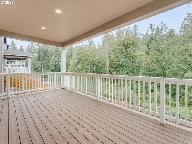 a living room with furniture and a dining table