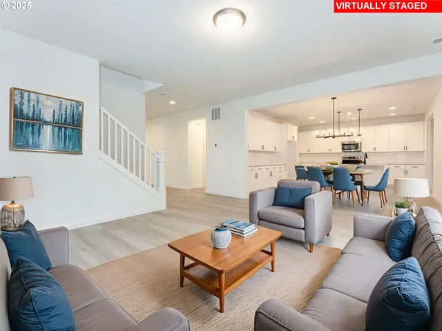 a view of kitchen with cabinets table and chairs