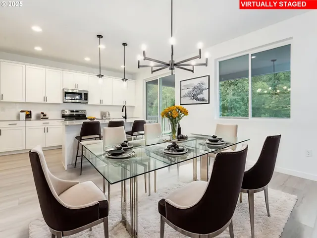 a bedroom with bed and paintings on the wall