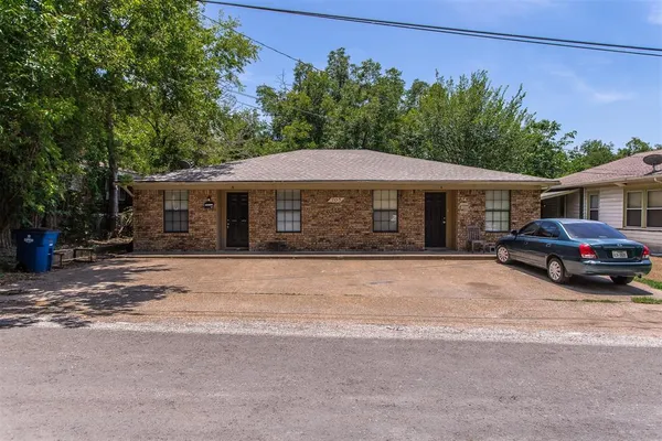 a house with trees in the background