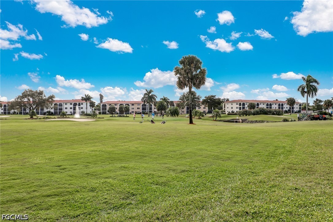 9 High Point Circle North, Unit 101 Naples, FL 34103 - Photo 46 of 49 a view of a park with lots of palm trees