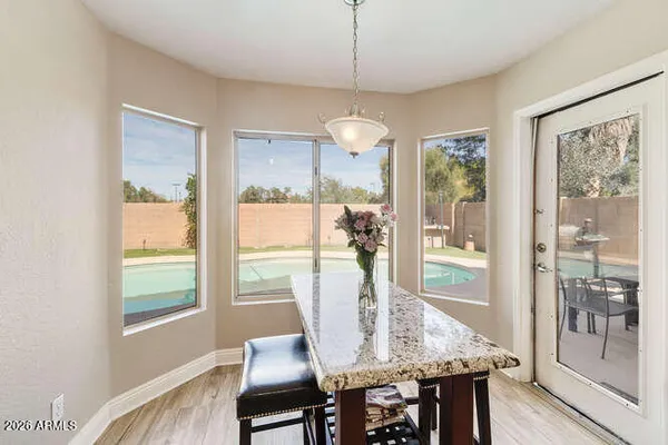 a view of a dining room with furniture window and wooden floor