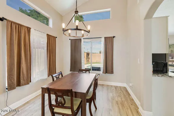 a view of a dining room with furniture window and wooden floor