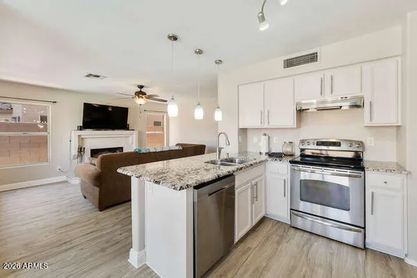 a kitchen with a stove and a sink