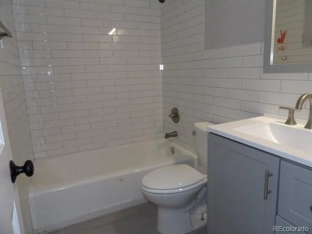 a bathroom with a sink toilet and bathtub