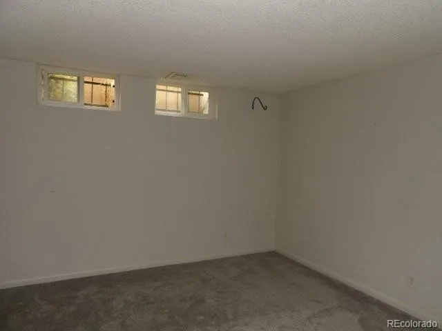 a workspace with furniture and a potted plant