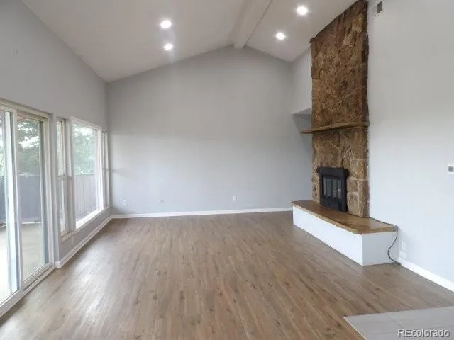 a living room with furniture and fireplace
