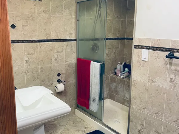 a bathroom with a sink and a shower