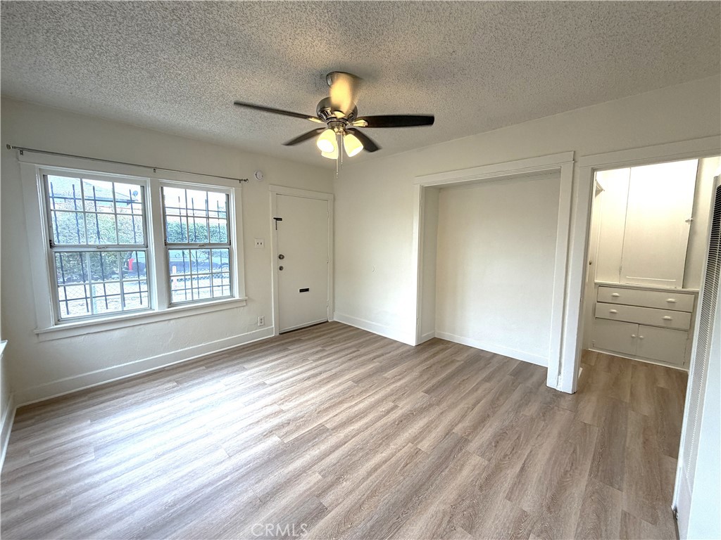 5425 2nd Avenue Los Angeles, CA 90043 - Photo 3 of 10 wooden floor in an empty room with a window