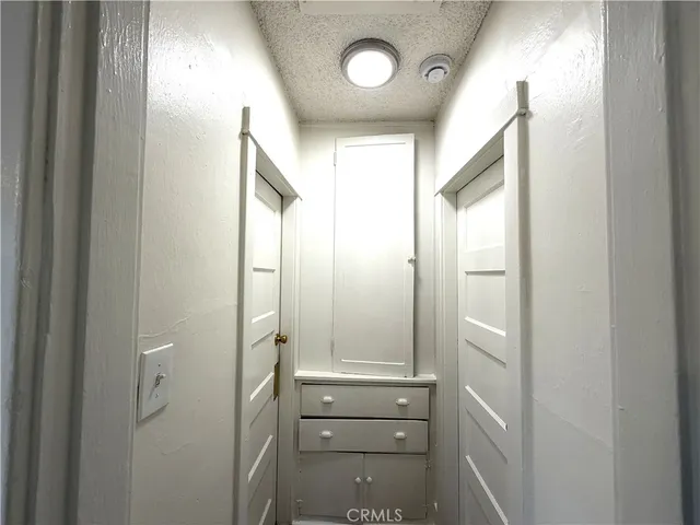 a bathroom with a shower and a mirror