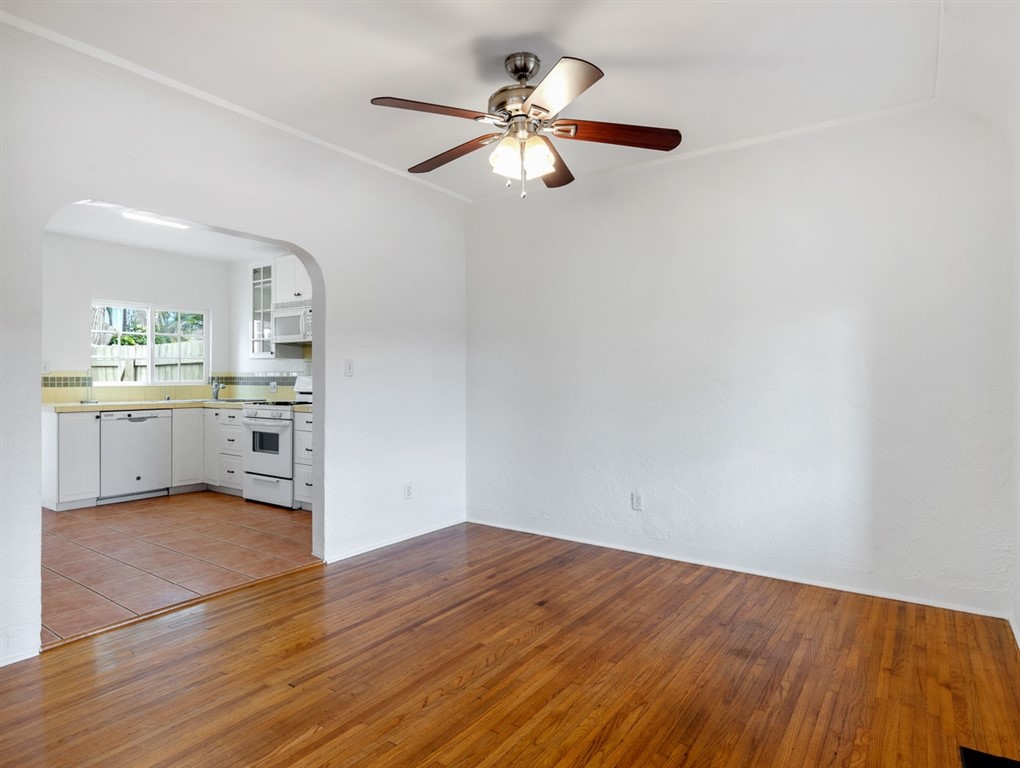 1980 Chatsworth Boulevard San Diego, CA 92107 - Photo 6 of 21 wooden floor in an empty room with a window