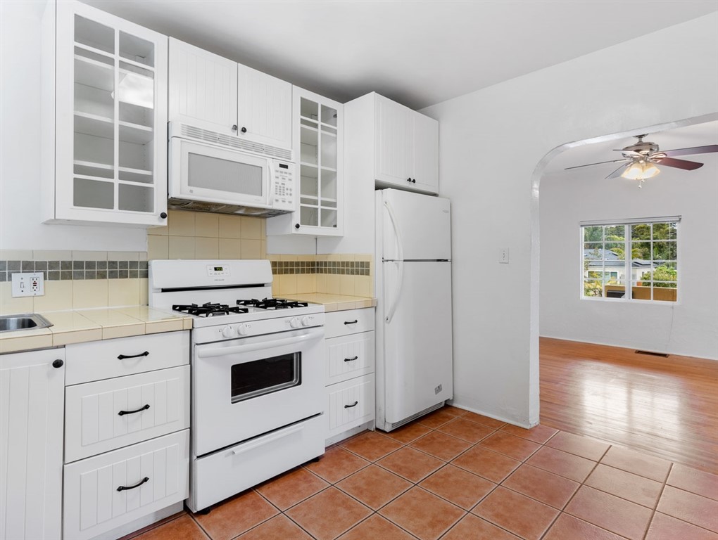1980 Chatsworth Boulevard San Diego, CA 92107 - Photo 9 of 21 a kitchen with cabinets and appliances