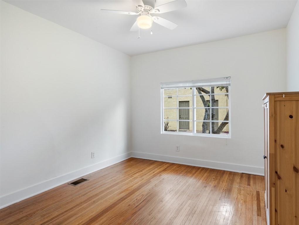 1980 Chatsworth Boulevard San Diego, CA 92107 - Photo 10 of 21 an empty room with wooden floor and windows