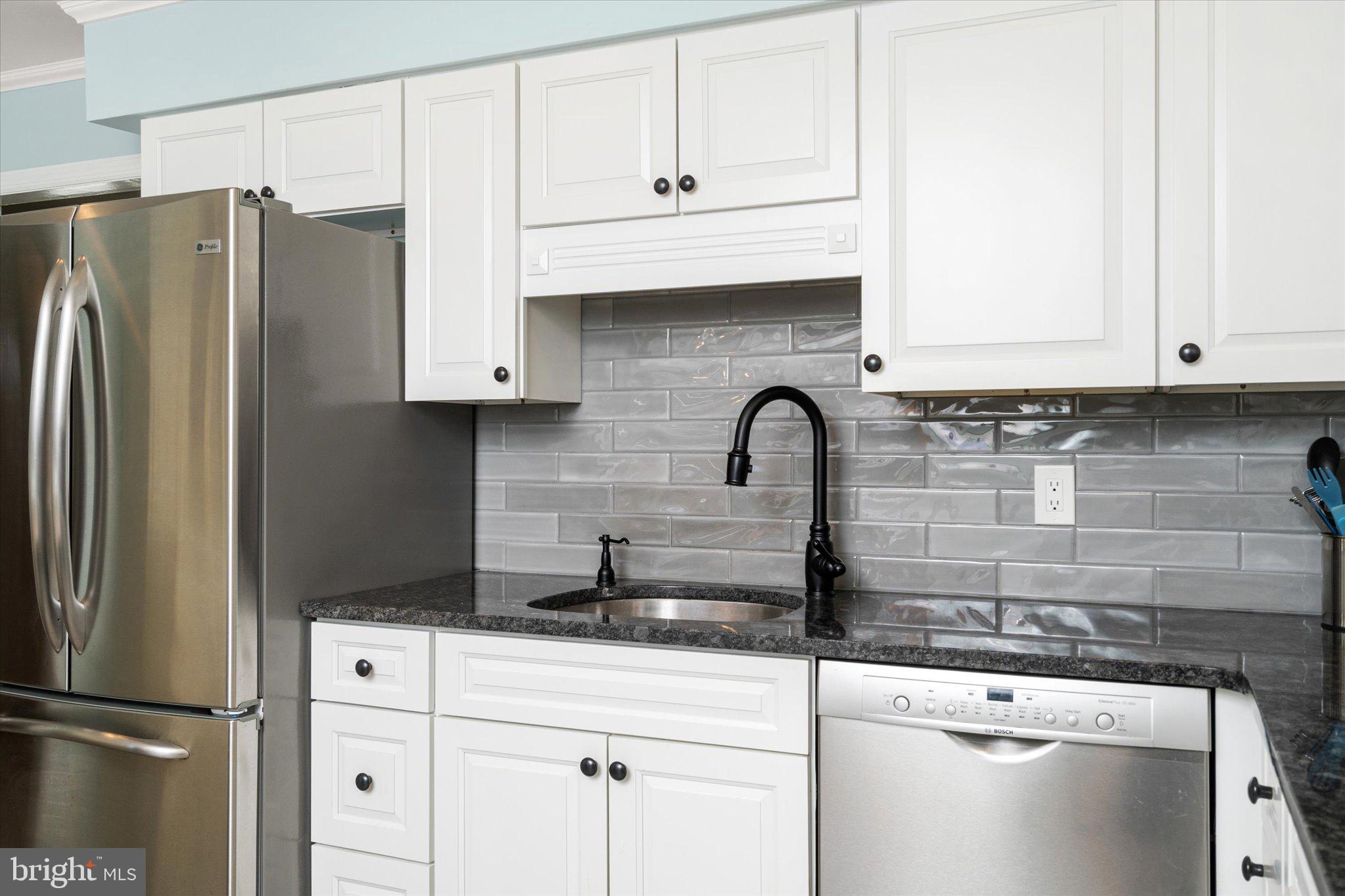 8 Wayne Way East Windsor, NJ 08520 - Photo 14 of 29 a kitchen with granite countertop a refrigerator sink and cabinets