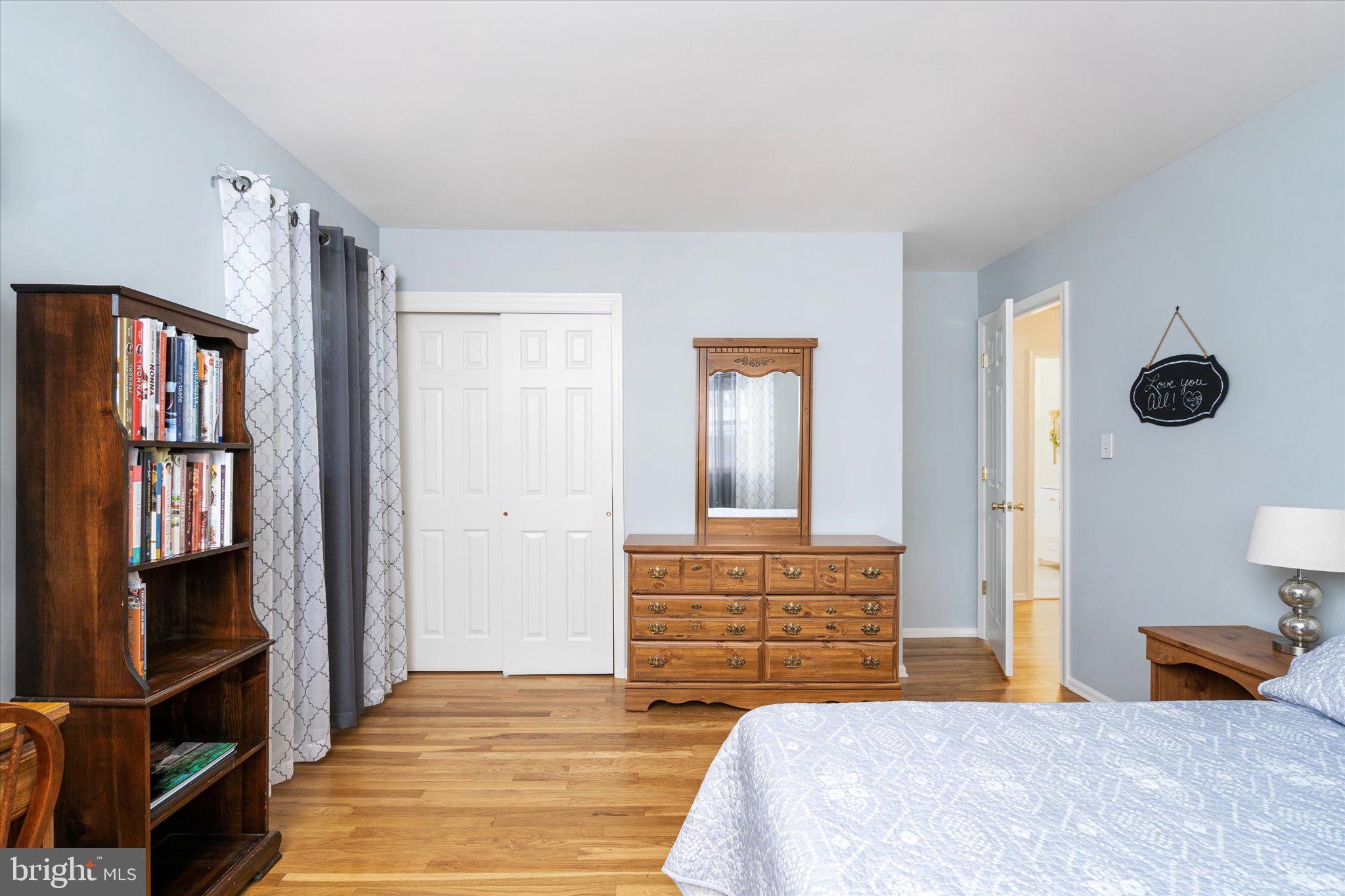 8 Wayne Way East Windsor, NJ 08520 - Photo 19 of 29 a bedroom with a large bed and a chandelier