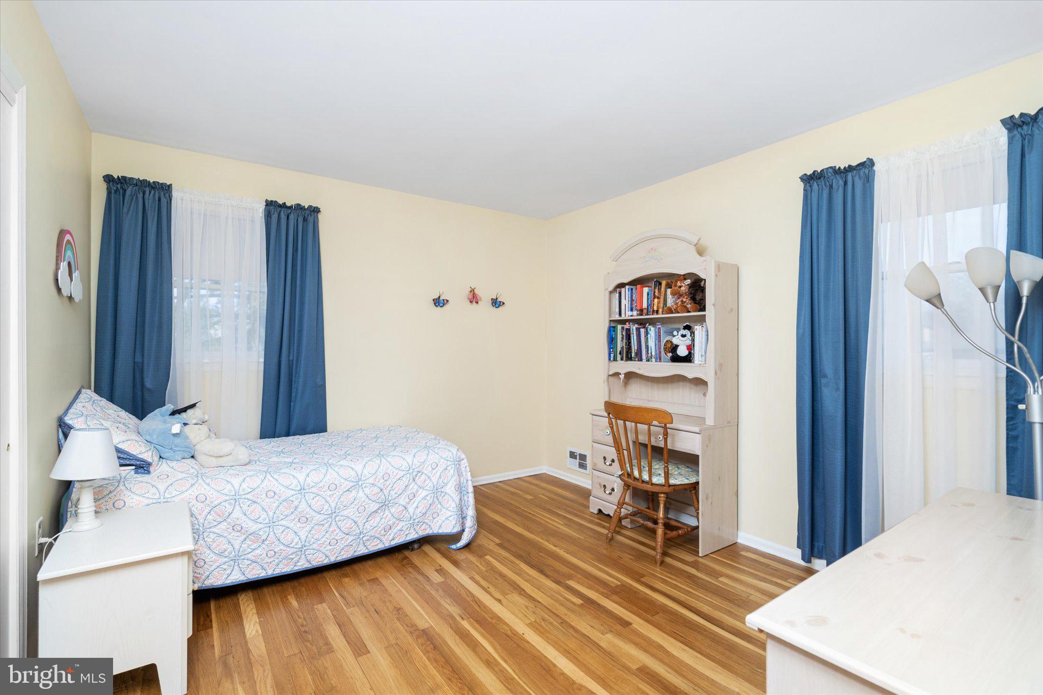 8 Wayne Way East Windsor, NJ 08520 - Photo 20 of 29 a bedroom with a bed and a book shelf