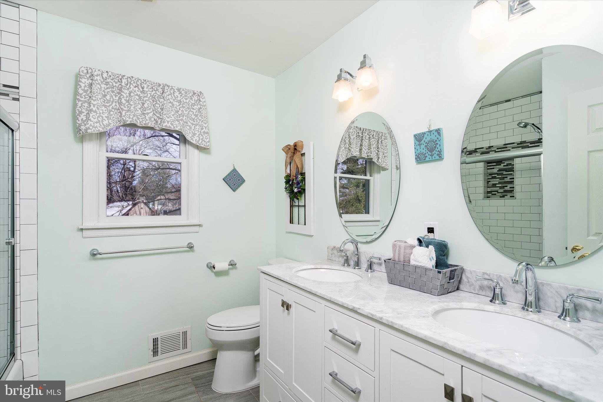 8 Wayne Way East Windsor, NJ 08520 - Photo 21 of 29 a bathroom with a toilet a sink and a mirror