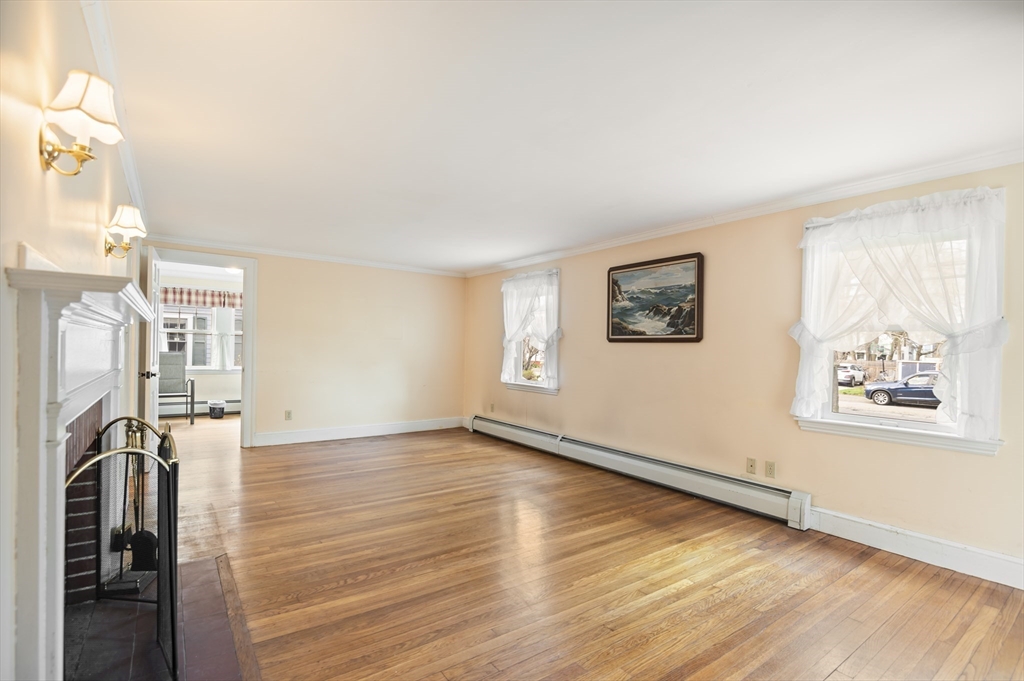 110 Linden Street Hamilton, MA 01982 - Photo 11 of 25 a view of a livingroom with wooden floor and a window