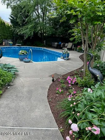 a view of a backyard of the house