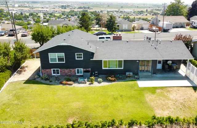 an aerial view of a house with swimming pool