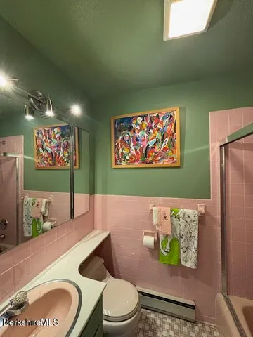 a bathroom with a toilet and a sink
