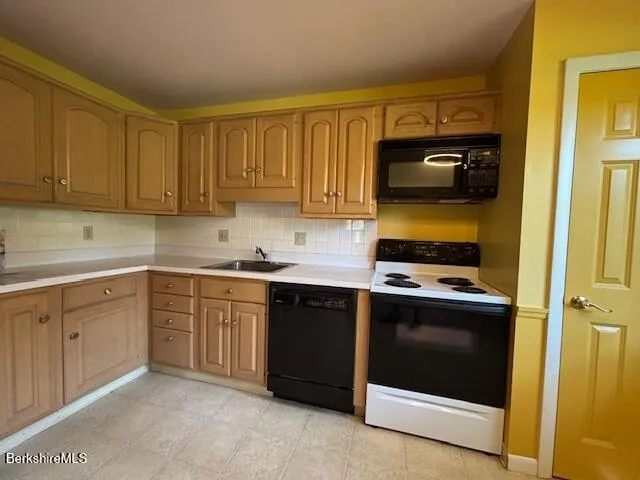 a kitchen with a stove and a microwave