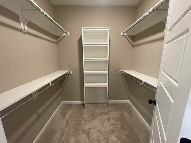 a view of an empty walk in closet