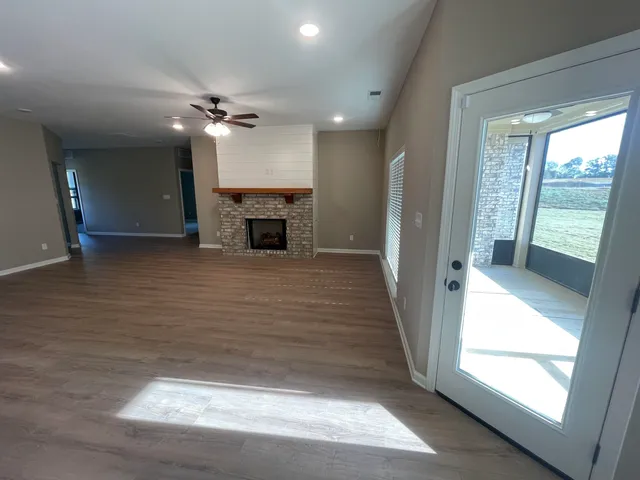 a view of a livingroom with a ceiling fan and window