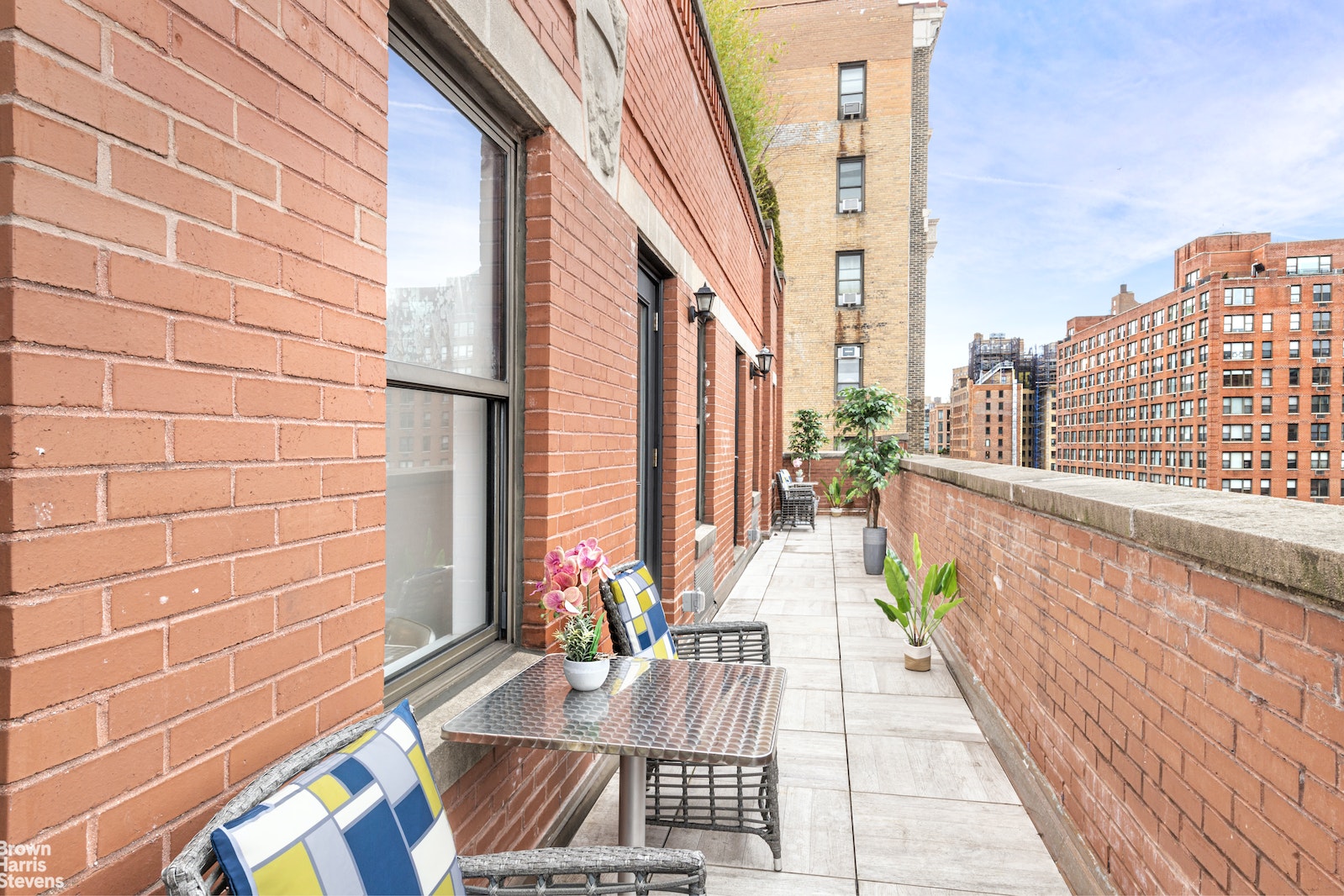 186 West 80th Street, Unit 11CD Manhattan, NY 10024 - Photo 1 of 1 a view of a balcony with chairs and wooden floor